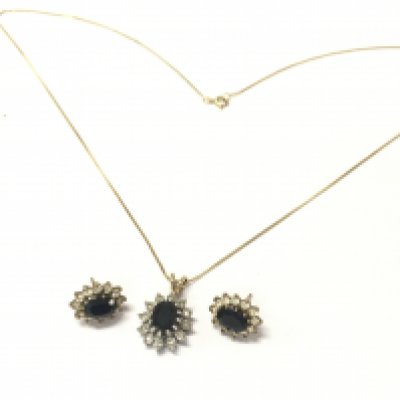 9ct gold sapphire and studs and a matching pendant on a 9 carat gold chain . 4.5g total weight. Postage catA