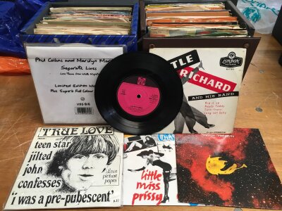 Eight record cases of 7" singles and EPs by various artists including The Who, Iron Maiden, Pink Floyd, Kate Bush and many more.