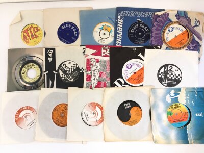 A record case of reggae and ska 7" singles by various artists including Prince Buster, Bob Marley, The Upsetters and others.