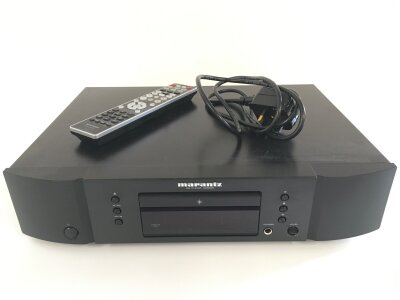 A Marantz CD5005 CD player with power lead and remote control.