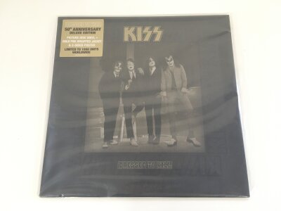 A deluxe limited edition Kiss Dressed To Kill picture disc with inserts. Mint and unplayed.