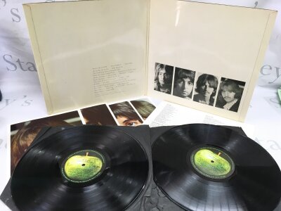 A numbered Beatles White Album PC 7068, complete with all inserts and black inners. Hairline marks, no deep scratches. No 0064914.