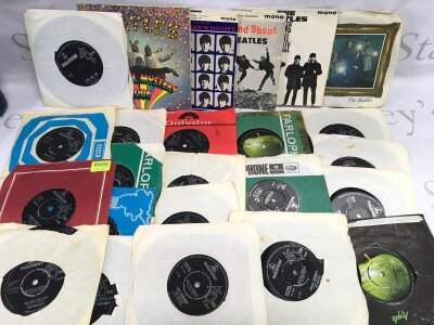 A collection of Beatles 7" singles and EPs including an Australian pressing of Love Me Do, A Hard Day's Night EP, Long Tall Sally EP and others.