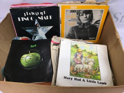 A collection of 7" singles and EPs plus a record case of LPs. Various artists including solo Beatles.