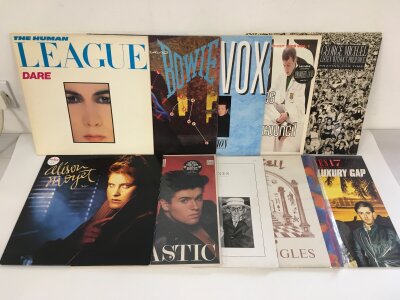 Two bags containing thirty LPs and 12" singles by various artists from the 1980s comprising Human League, Ultravox, Heaven 17 and many more.