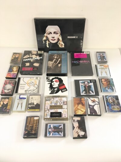 A collection of Madonna CD box sets, audio cassettes and a VHS, most CD sets are sealed.