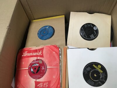 Four boxes of 7" singles by various artists including The Beatles, Elvis Presley,