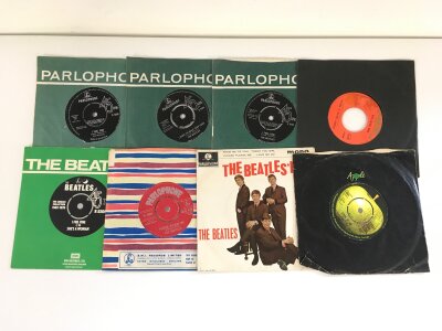 Eighteen Beatles and related 7" singles and EPs.