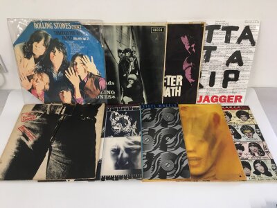 Two bags containing eighteen Rolling Stones and related LPs comprising Sticky Fingers, Goat's Head Soup, a sealed Mick Jagger 12" single etc.