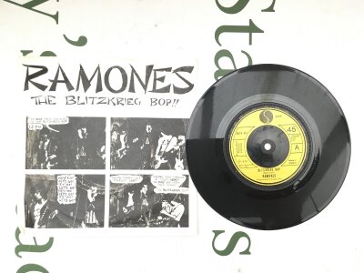 A first UK pressing of The Ramones - Blitzkrieg Bop 7" single in a picture sleeve (sleeve not original) . Vinyl EX.