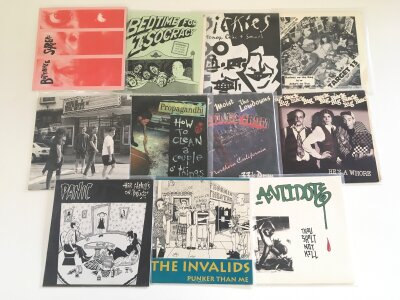 Eleven punk and hardcore 7" singles by various artists including The Butthole Surfers, Big Black, Antidote, The Dickies and others.
