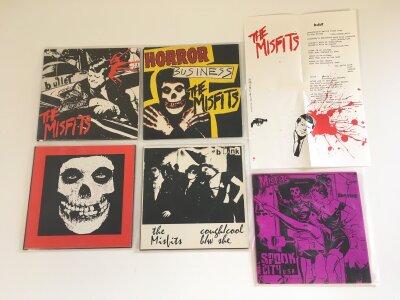 Five 7" singles by The Misfits comprising Bullet (with insert), Horror Business (with insert), Violent World, Cough/Cool and Spook City USA.