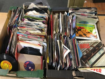 Two boxes of 7" singles by various artists including T Rex, The Rolling Stones, Frankie Goes To Hollywood and others.