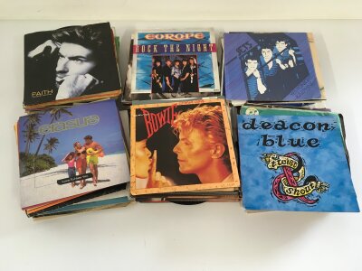 A box of LPs, 12" and 7" singles by various artists including David Bowie, Kate Bush, Madonna and others.