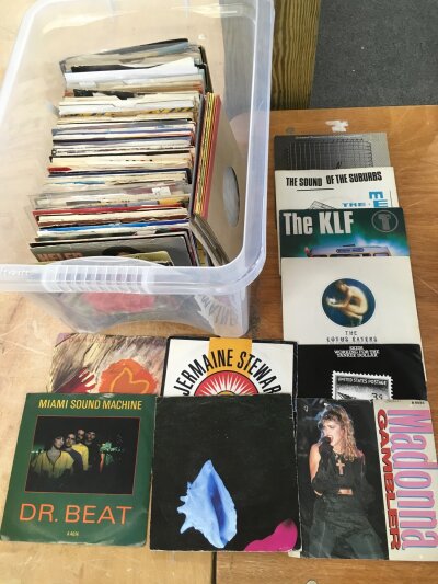 Three boxes of 7" singles by various artists including New Order, The KLF, PiL, OMD and many more.