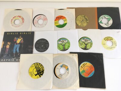A collection of reggae and ska 7" singles by various artists including Prince Buster, Sugar Minott, Beeny Man and others.