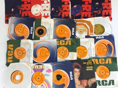A collection of 7" and 12" singles including David Bowie and T Rex examples plus many other artists.