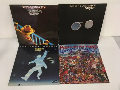 Four Gordon Giltrap LPs comprising Fear Of The Dark, Visionary, Perilous Journey and The Peacock Party. Vinyl NM.