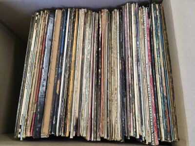 A box of LPs by various artists including a US pressing of Revolver by The Beatles, a red/plum Atlantic label Led Zeppelin III, a Woodstock 3LP box set and many more.
