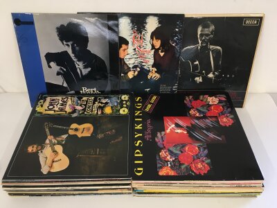 A collection of mainly folk LPs by various artist artists including Bert Jansch, Davy Graham, Paul Simon and others.