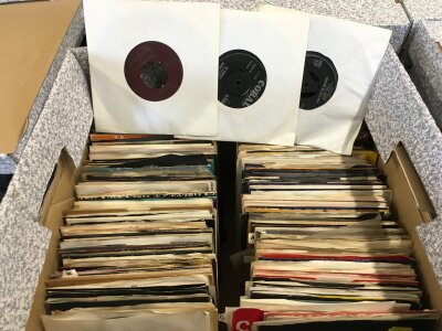 Four boxes of 7" singles and EPs by various artists including The Rolling Stones, David Bowie, George Clinton and others including some demo/promo discs.