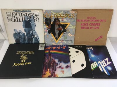 Two bags containing fourteen rock LPs and 12" singles by various artists including Alice Cooper, Little Angels, Free and others.