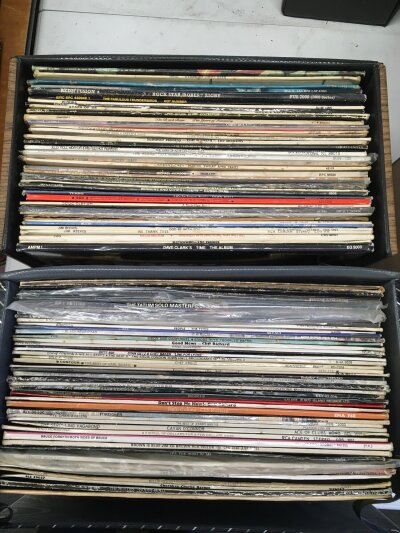 Eight record cases of LPs by various artists including Pink Floyd, Paul McCartney, Johnny Burnette, Aerosmith and others.