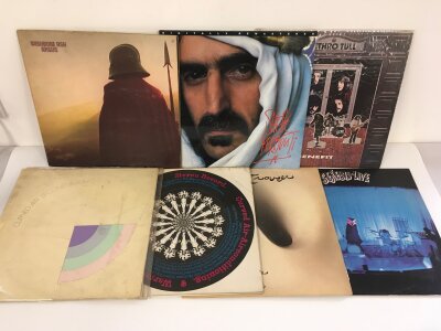 Two bags containing fourteen prog rock LPs by various artists including Jethro Tull, Frank Zappa, Wishbone Ash and others.
