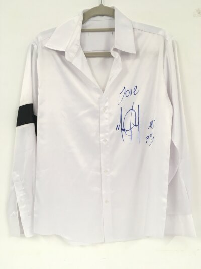 Michael Jackson. A silk shirt signed in blue marker pen by Michael during the This Is It rehearsals in Los Angeles and given to his friend and personal assistant Frank Cascio. Comes with a letter of authenticity from Frank Cascio.