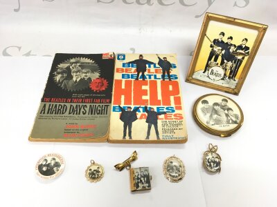 A small collection of Beatles memorabilia comprising compact, brooches, books etc.