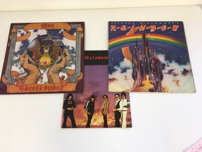 A Rainbow and a Dio LP both signed by Ronnie James Dio plus a Rainbow tour program. No COA.