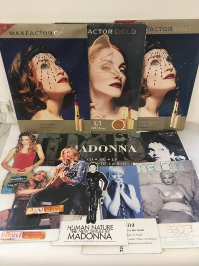 A collection of Madonna advertising standees and shop displays.