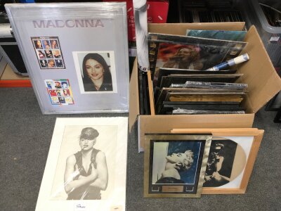 A collection of framed Madonna posters, pictures, film cels etc