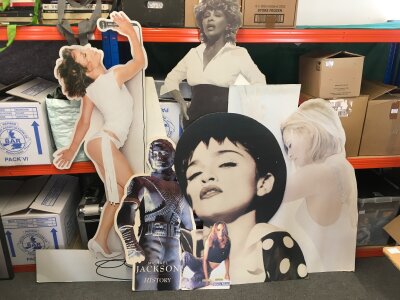 A collection of large music advertising standees of various artists including Madonna, Kylie Minogue, Michael Jackson and others.