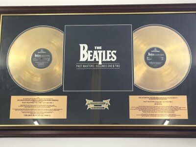 A framed and glazed limited edition Beatles double gold disc display for the Past Masters album,  numbered 626/5000, approx 99cm x 60cm.