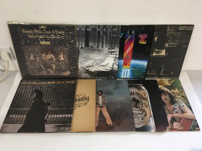 Two bags containing eighteen Crosby, Stills, Nash & Young and related LPs comprising Deja Vu, After The Gold Rush, a 180g pressing of This Path Tonight and others.