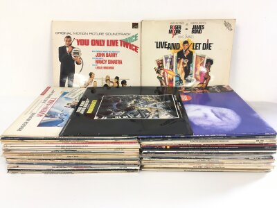 A collection of film soundtrack LPs including various James Bond soundtracks, The Lost Boys, The Deep and many more.