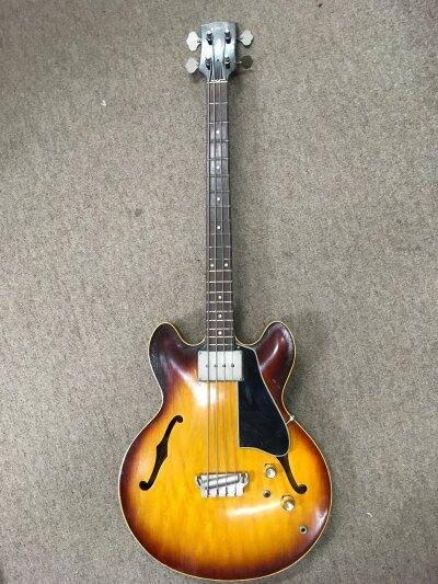 A circa 1964 Gibson EB2 bass guitar in a tobacco sunburst finish, serial number 6725. Comes with an Epiphone branded hard carry case.