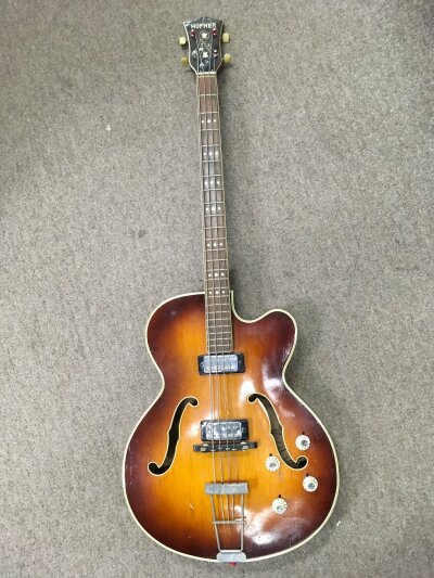 A circa 1966 Hofner President 520 bass guitar, brunette model. Missing scratch plate. Comes with a hard carry case.