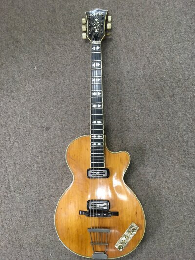 A circa 1960 Hofner Club 60 electric guitar, serial number 1236. Repair to the neck and missing scratch plate plus age related wear. Comes with a hard carry case.