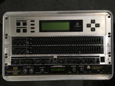 Four rack mounts comprising a Behringer Ultra Curve 24 bit dual DSP mainframe DSP8000, a Behringer Ultra Graph Pro, Composer Pro and a Peavey Addverb effects processor. Comes in a hard shell flight case.