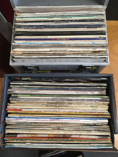 Eight record cases of LPs by various artists including Queen, Michael Jackson, Pink Floyd and many more.