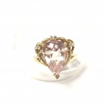 A 14ct gold ring set with a large pear shaped eye clean morganite with 2 diamonds and 1 marquise cut diamond with gem report.