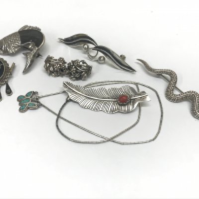 Silver jewellery including Native American and Mexican brooches , two pairs of earrings and pendant , snake brooch, fish brooch, leaf brooch