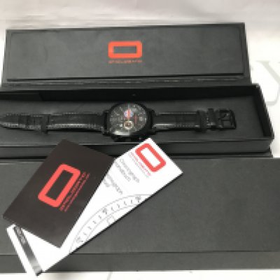 A boxed Omologato Mahindra Racing Formula E team Gents wrist watch. Postage category B