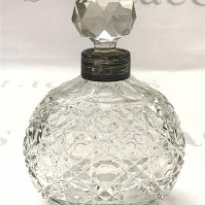 A silver Hallmarked topped cut crystal glass bottle , this lot cannot be posted