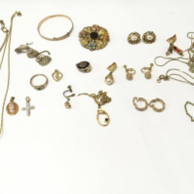 A collection of assorted gold tone jewellery.