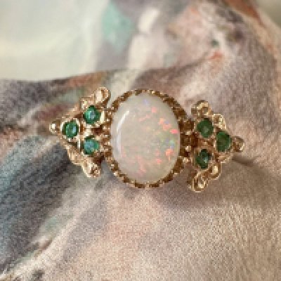 A 9ct gold emerald and opal set ring, Approx weight 2.18 grams, Approx size M.