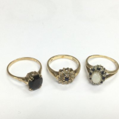 Three 9ct gold rings set with stones, approx total weight 7.5g. Shipping category A.