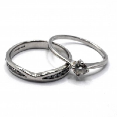 A 950 Platinum 0.25ct solitare diamond ring together with a diamond set platinum band. Size P (A)